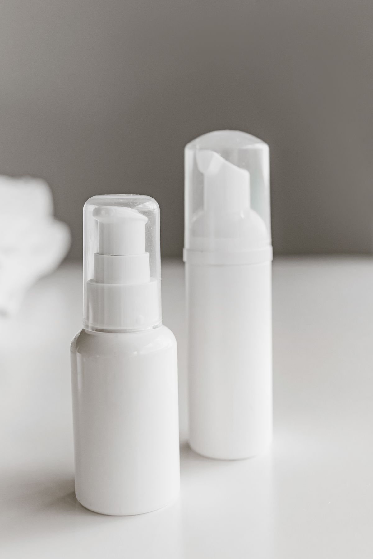 Unbranded cosmetic product bottles ready for labeling